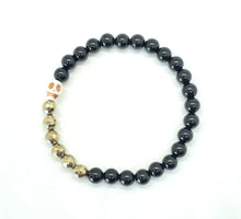 Load image into Gallery viewer, Black Onyx Howlite Skull bracelet