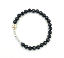 Load image into Gallery viewer, Black Onyx Howlite Skull bracelet